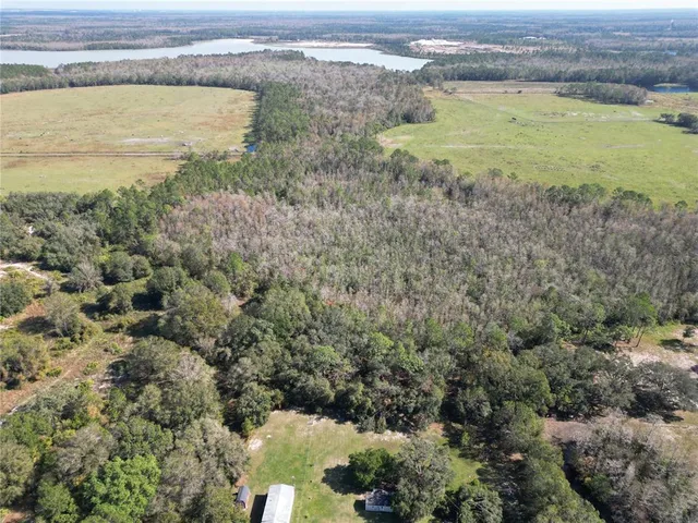 a view of a field with an ocean view