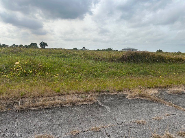 180 Concord Loop LaBelle, FL 33935 - Photo 2 of 3 a view of a lake with mountain in the background