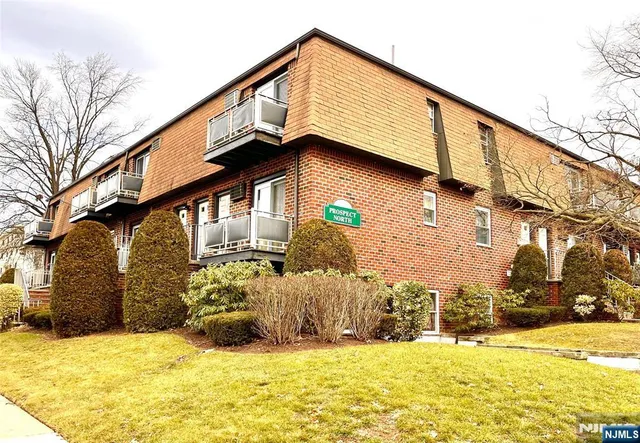 a view of a house with snow on the road