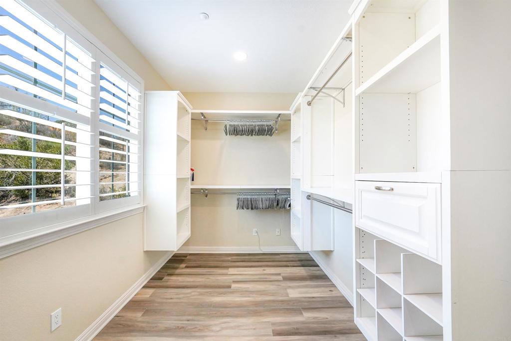 22963 Stokes Road Ramona, CA 92065 - Photo 35 of 57 a view of a hallway with wooden floor and staircase