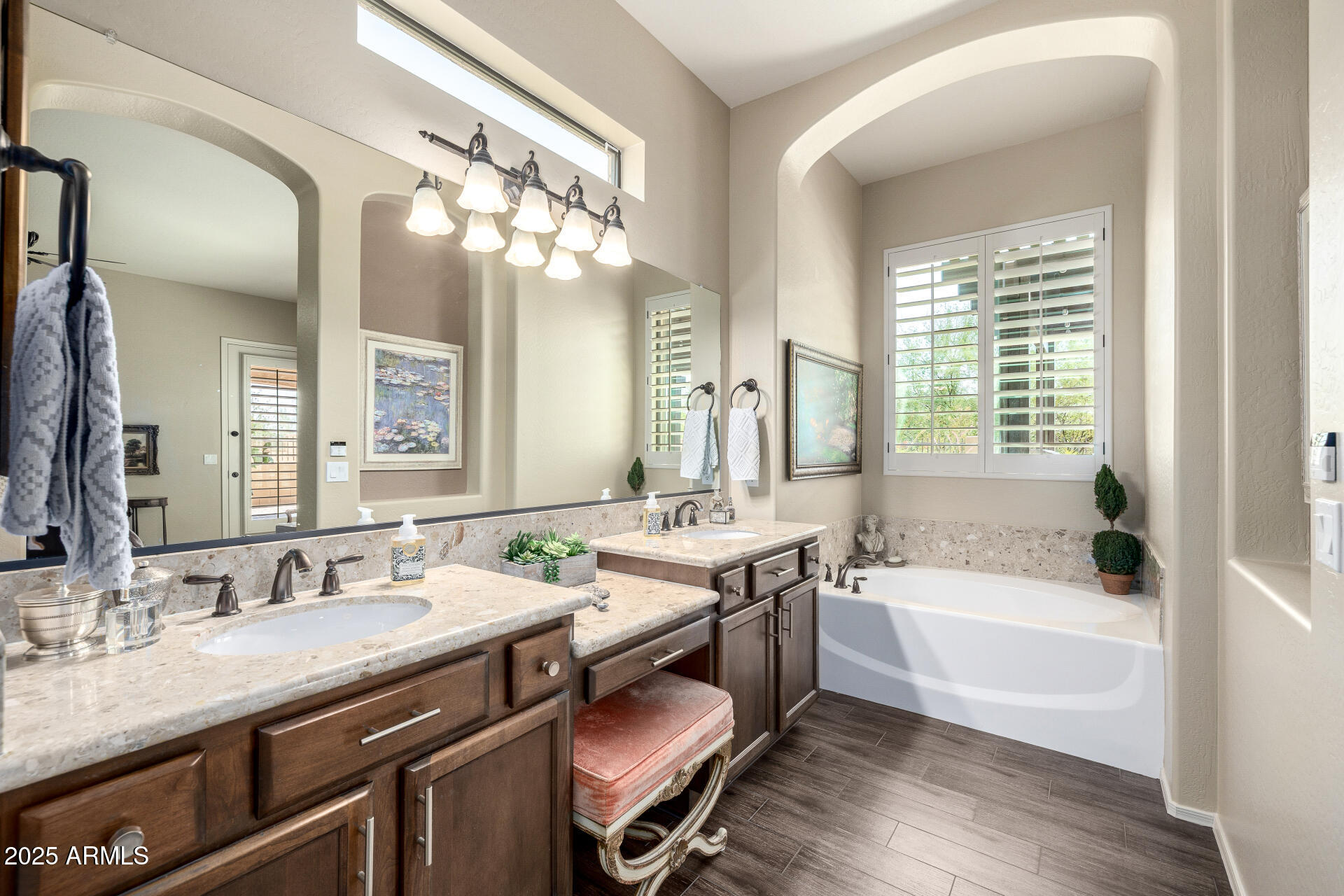 1822 North Waverly Mesa, AZ 85207 - Photo 45 of 91 a bathroom with a granite countertop sink a large mirror a bathtub and shower