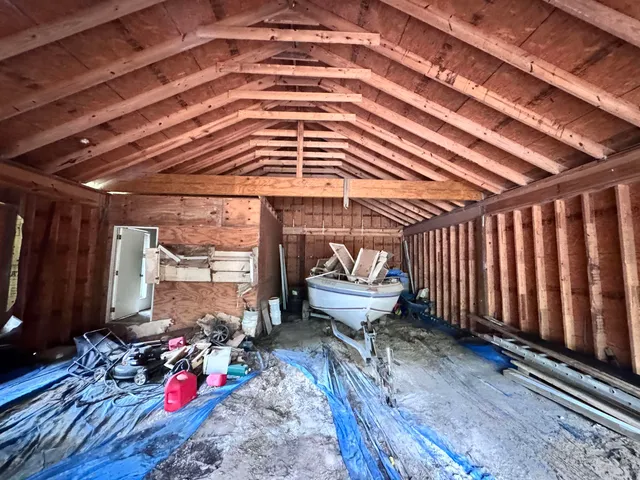 a roof deck with a potted plant and outdoor space