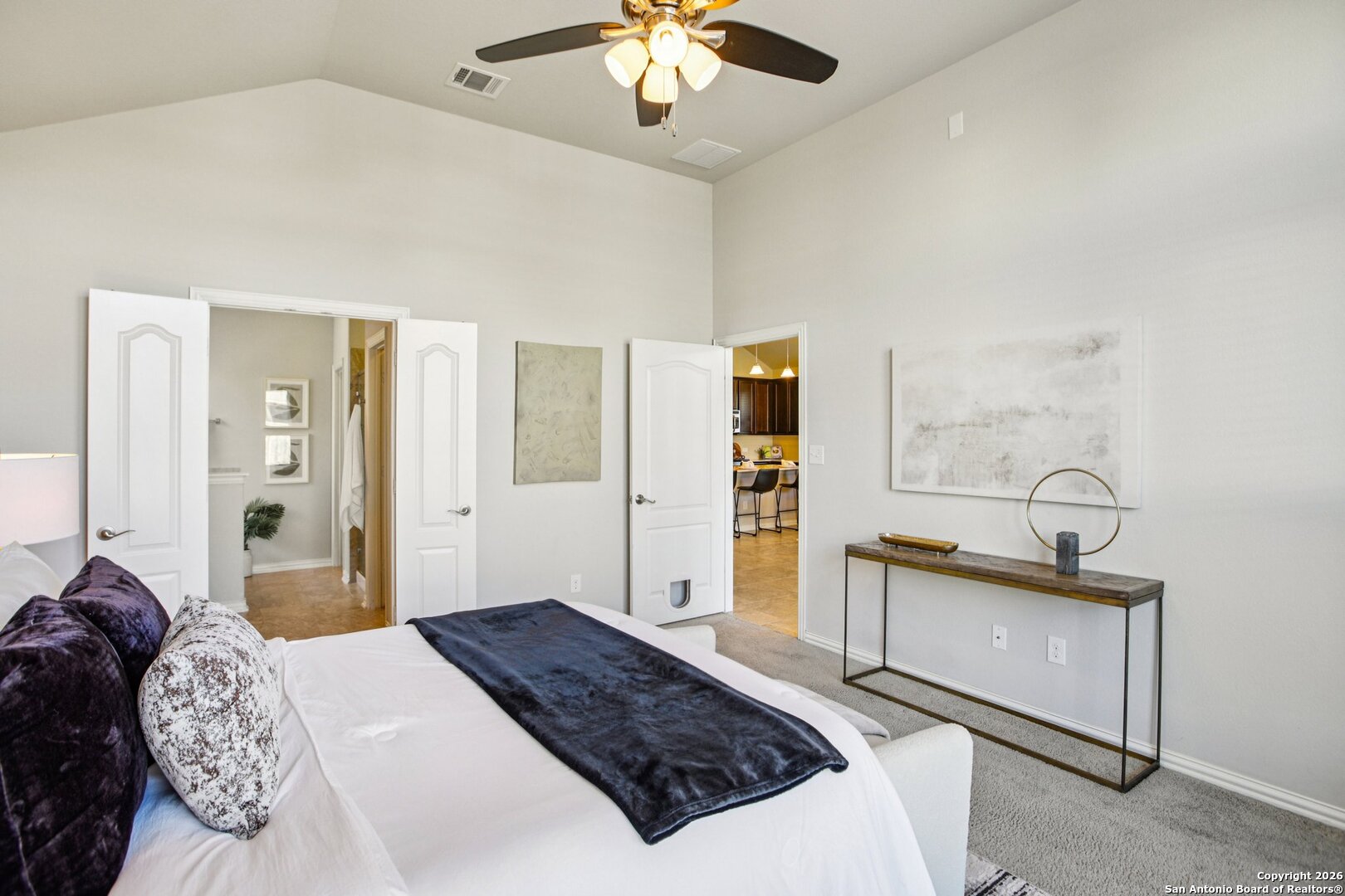 732 Bonnet Boulevard Georgetown, TX 78628 - Photo 17 of 55 a bedroom with a bed and a chandelier