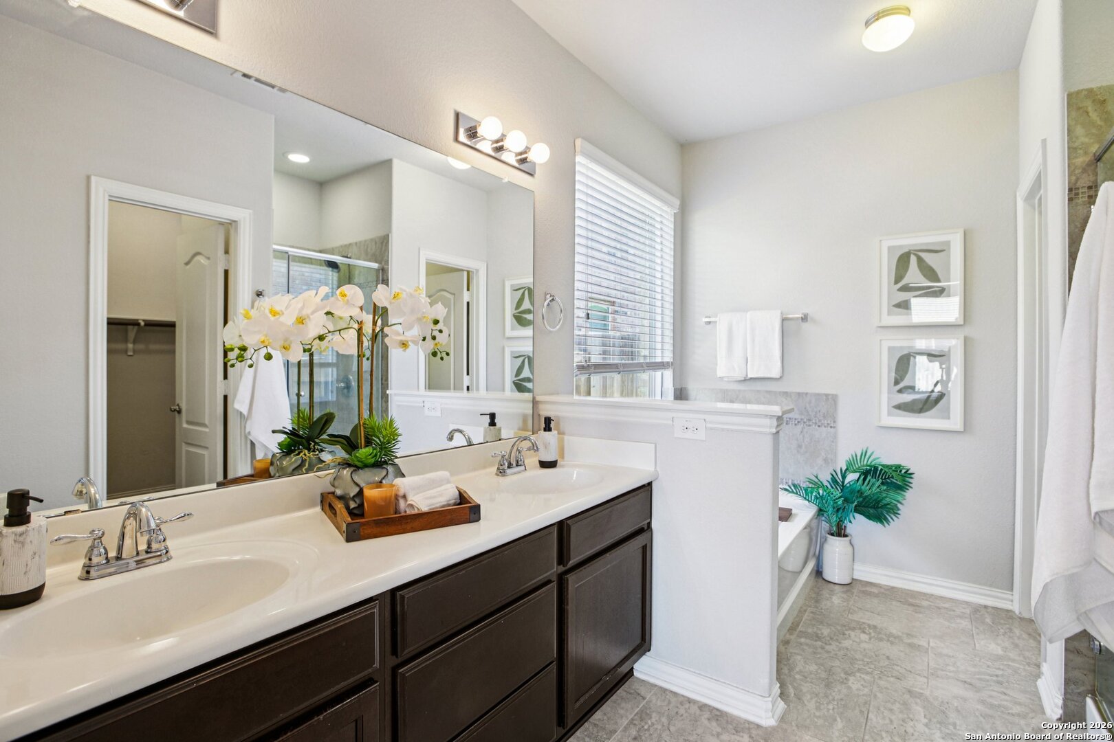 732 Bonnet Boulevard Georgetown, TX 78628 - Photo 19 of 55 a bathroom with a sink a double vanity and a mirror