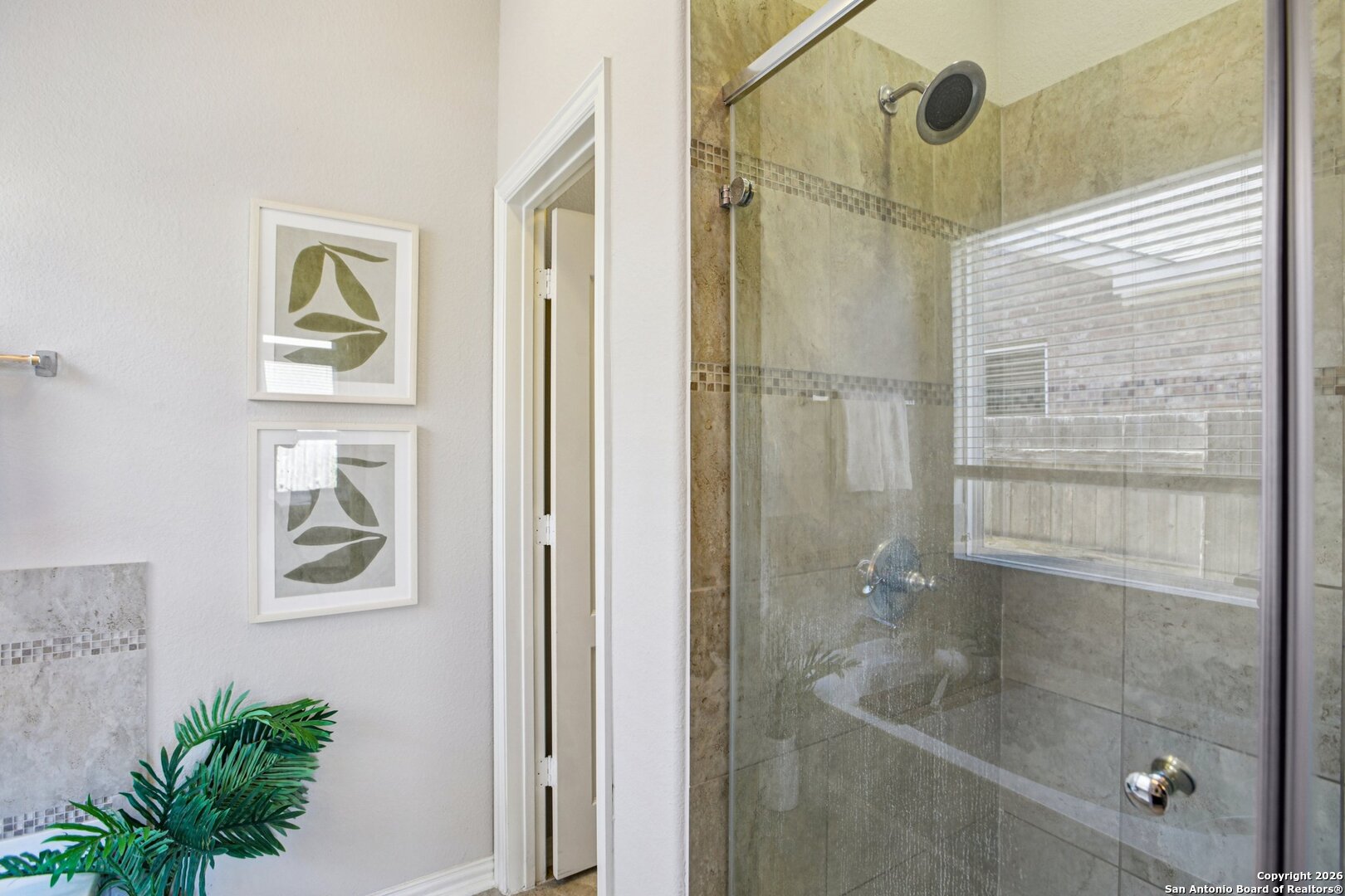 732 Bonnet Boulevard Georgetown, TX 78628 - Photo 22 of 55 a bathroom with a glass shower door