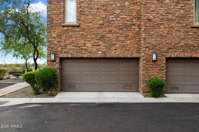 a view of a house with a small yard