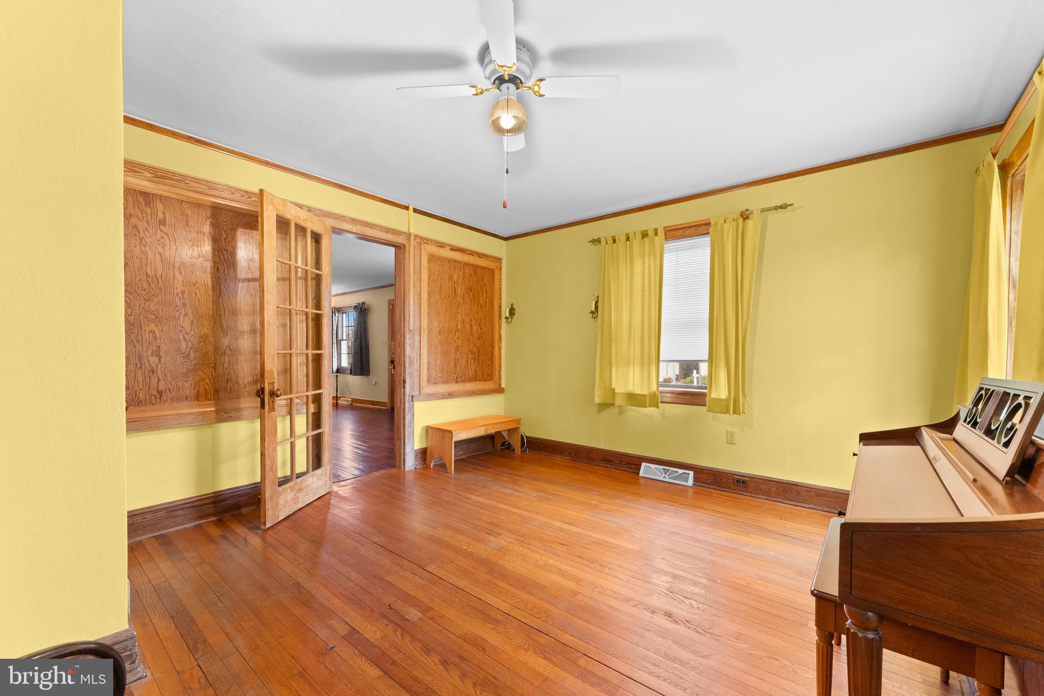 210 Elizabeth Street Culpeper, VA 22701 - Photo 11 of 48 a view of an empty room with a window and wooden floor