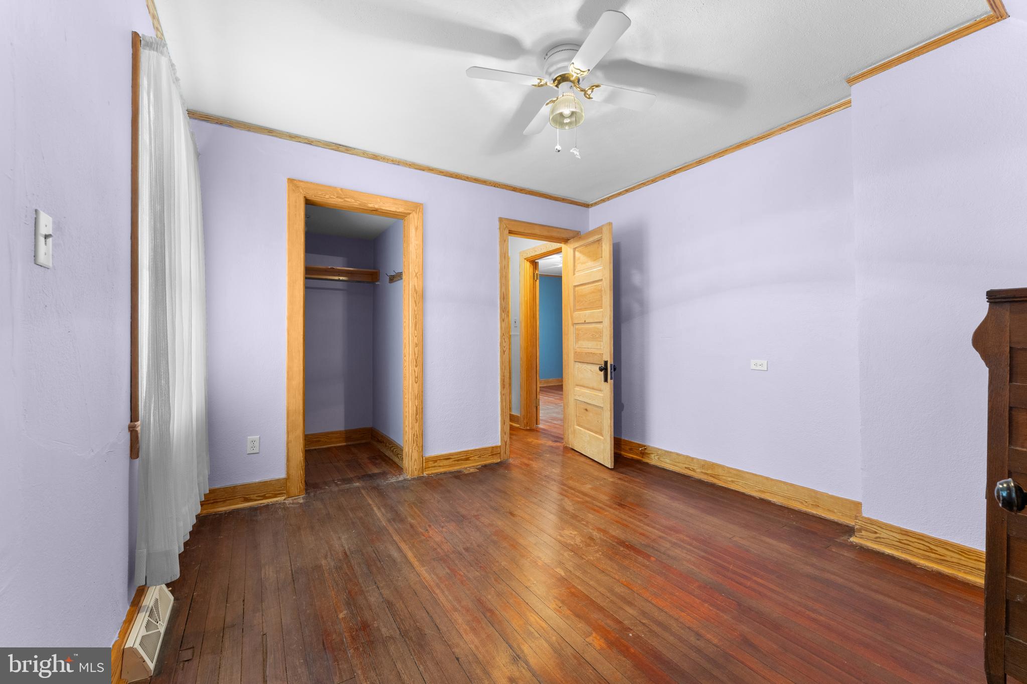 210 Elizabeth Street Culpeper, VA 22701 - Photo 12 of 48 a view of an empty room with window and wooden floor