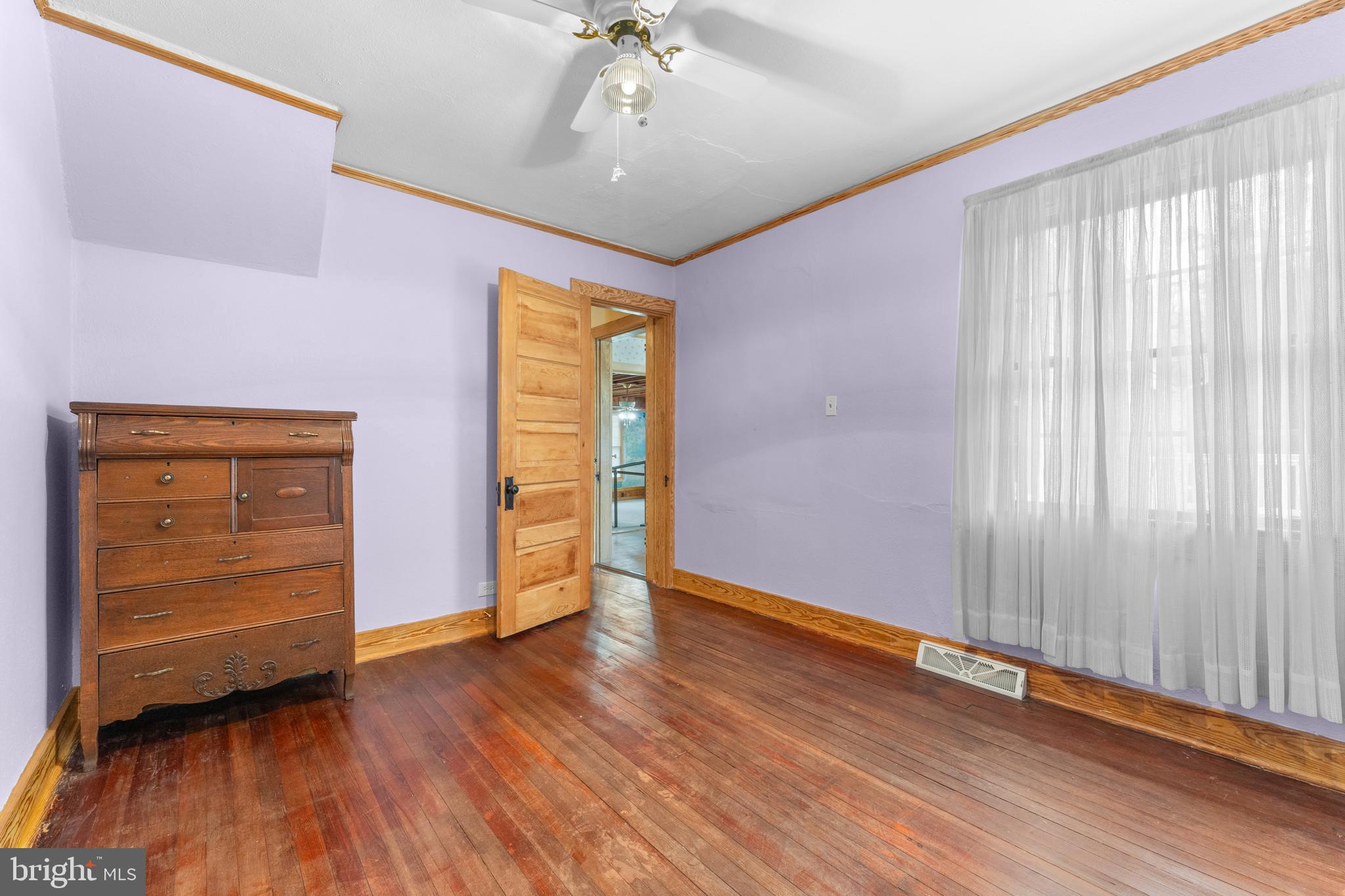 210 Elizabeth Street Culpeper, VA 22701 - Photo 13 of 48 wooden floor in an empty room with a window