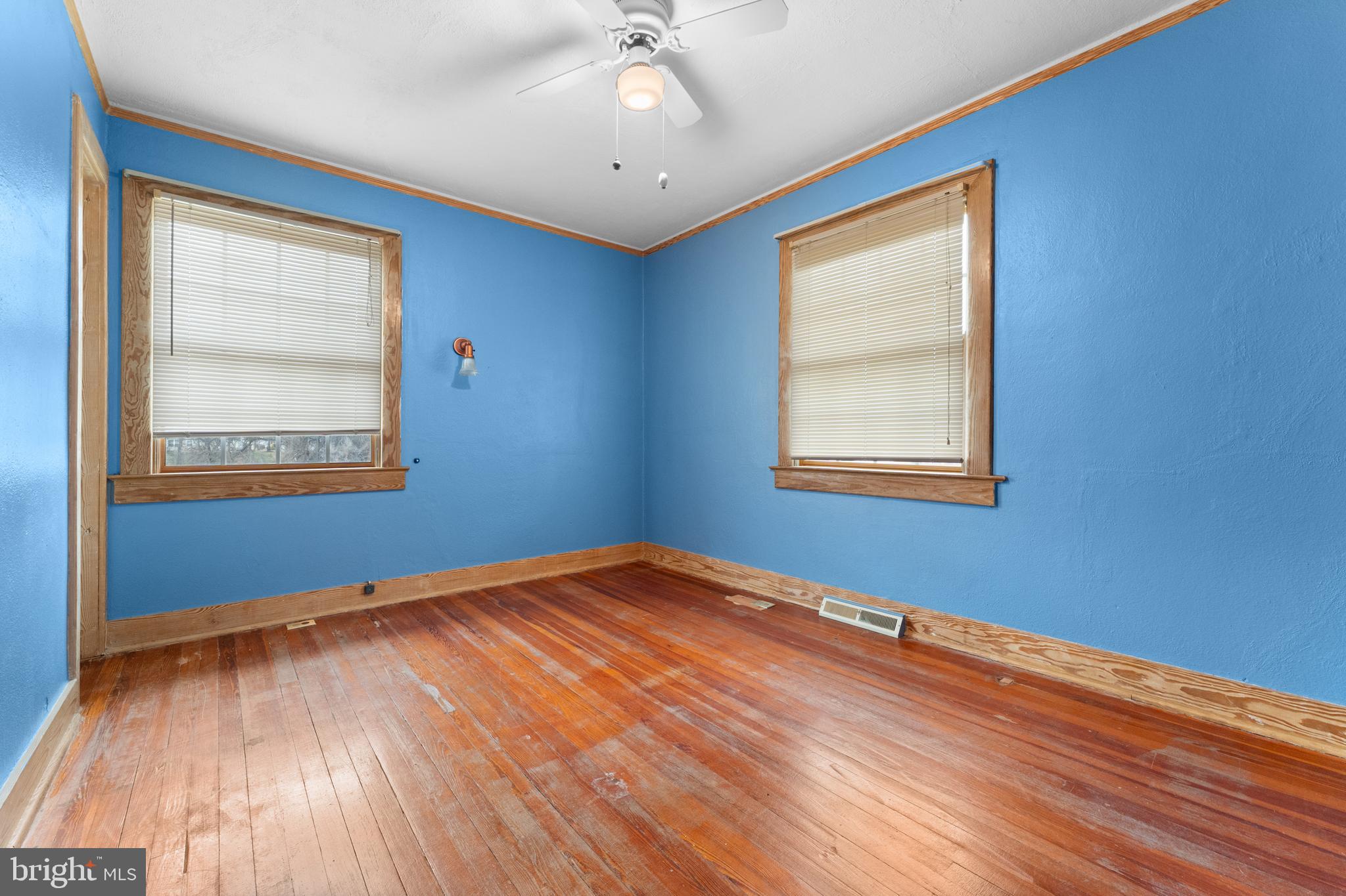 210 Elizabeth Street Culpeper, VA 22701 - Photo 16 of 48 a view of an empty room with wooden floor and a window