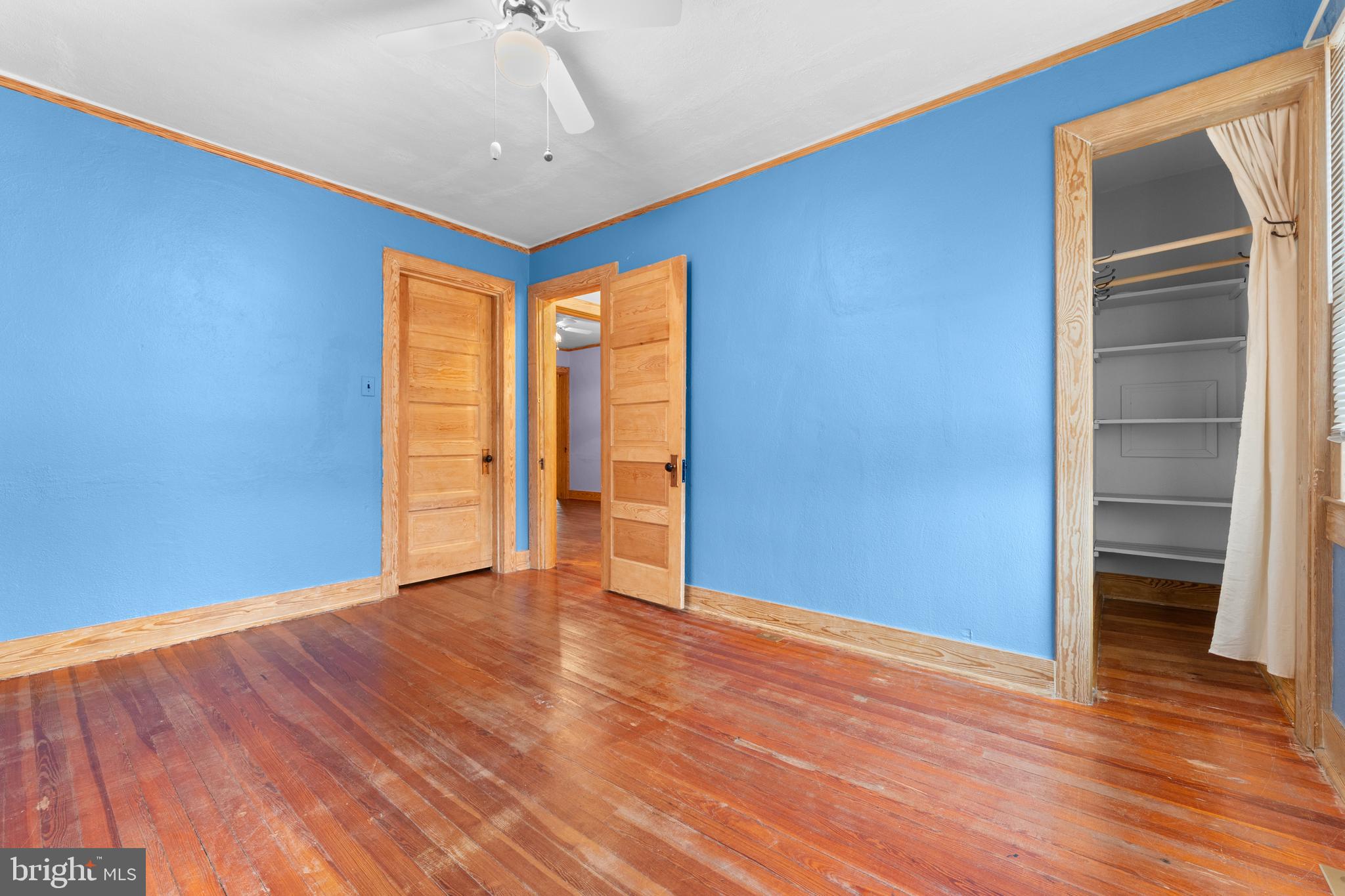 210 Elizabeth Street Culpeper, VA 22701 - Photo 17 of 48 a view of an empty room with wooden floor and a window
