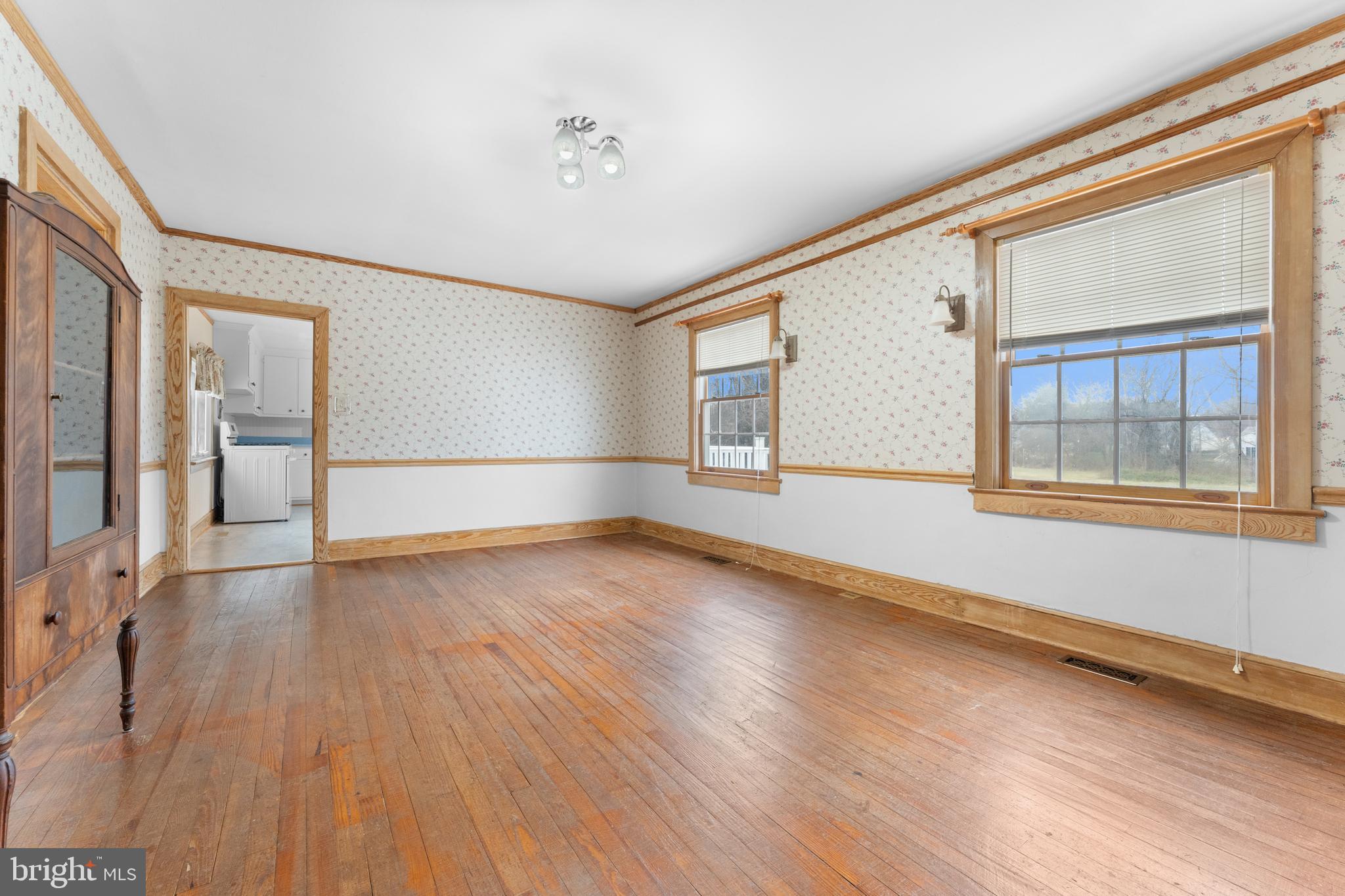 210 Elizabeth Street Culpeper, VA 22701 - Photo 18 of 48 a view of an empty room with wooden floor and a window