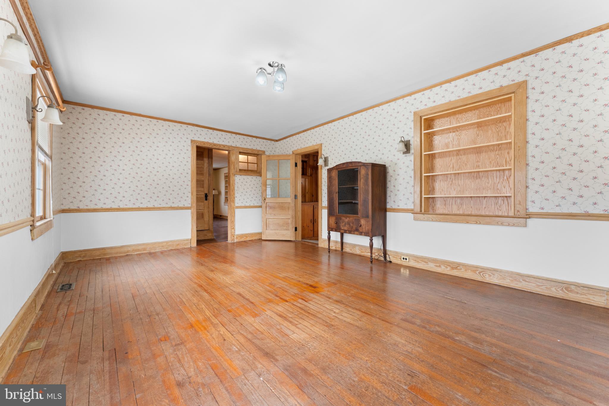 210 Elizabeth Street Culpeper, VA 22701 - Photo 19 of 48 wooden floor in an empty room with a window