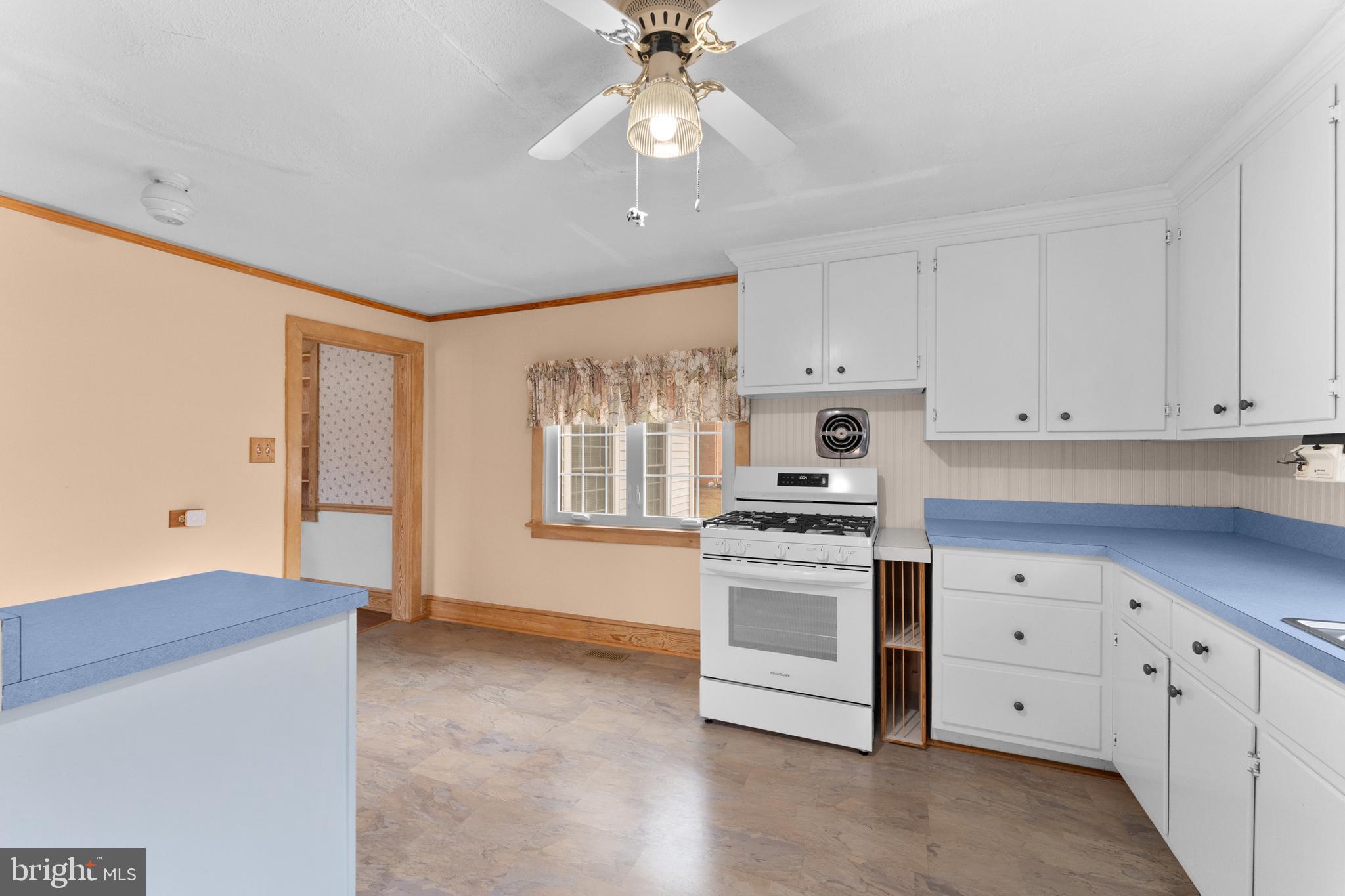 210 Elizabeth Street Culpeper, VA 22701 - Photo 27 of 48 a kitchen with cabinets appliances and a window