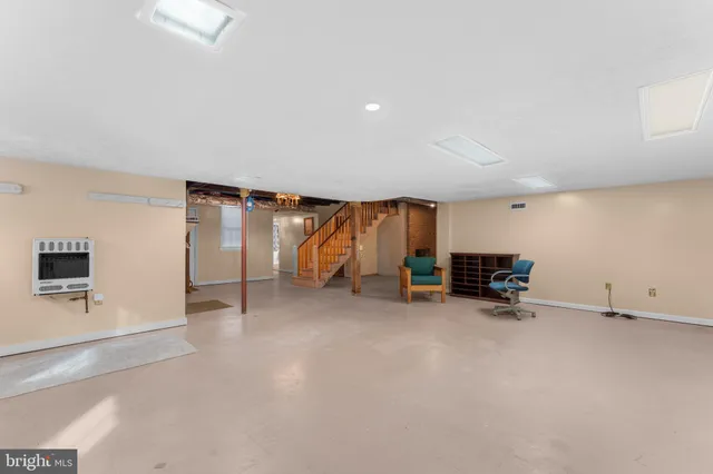 a view of an empty room with stairs