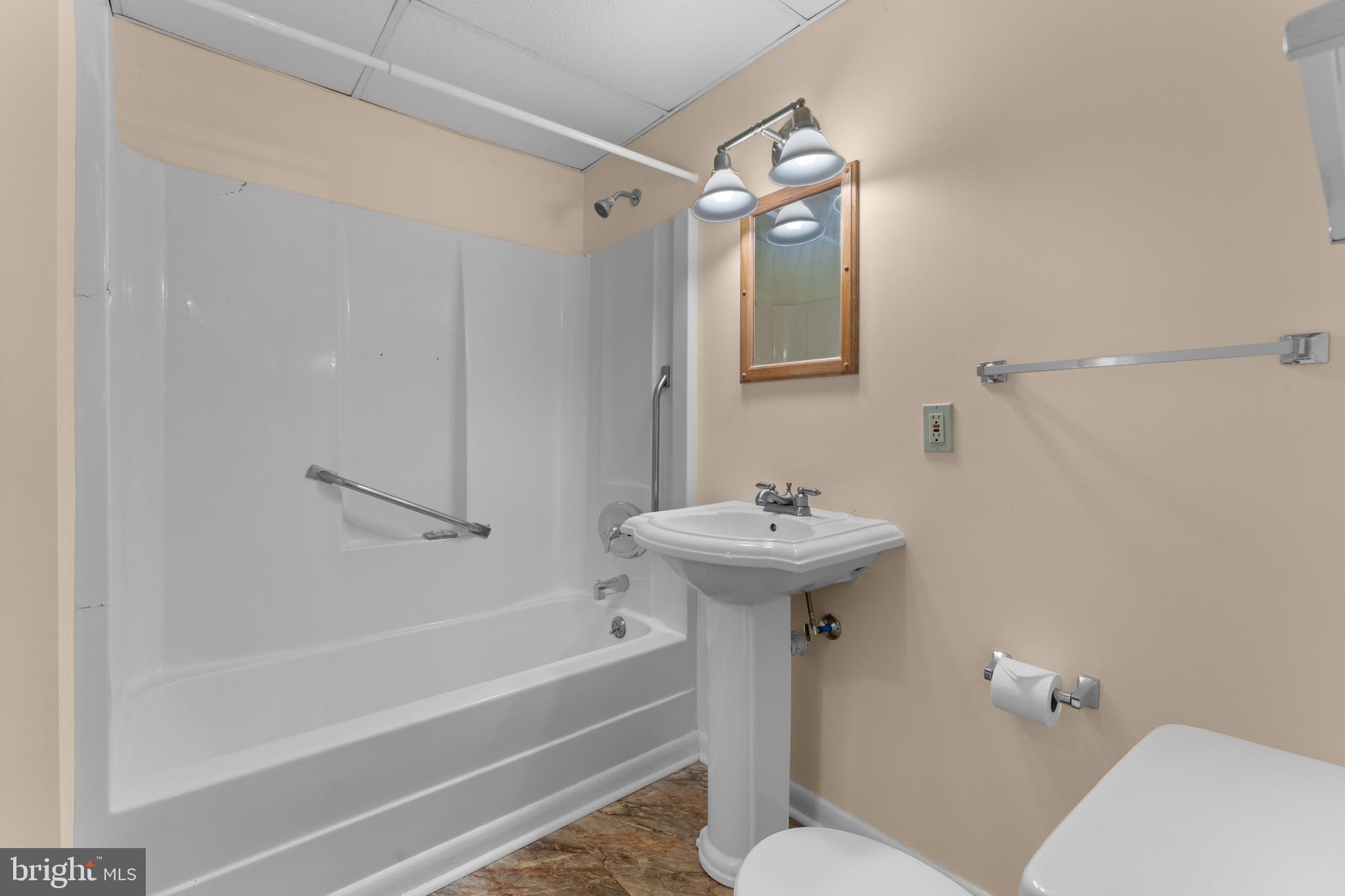 210 Elizabeth Street Culpeper, VA 22701 - Photo 37 of 48 a bathroom with a sink a toilet and shower