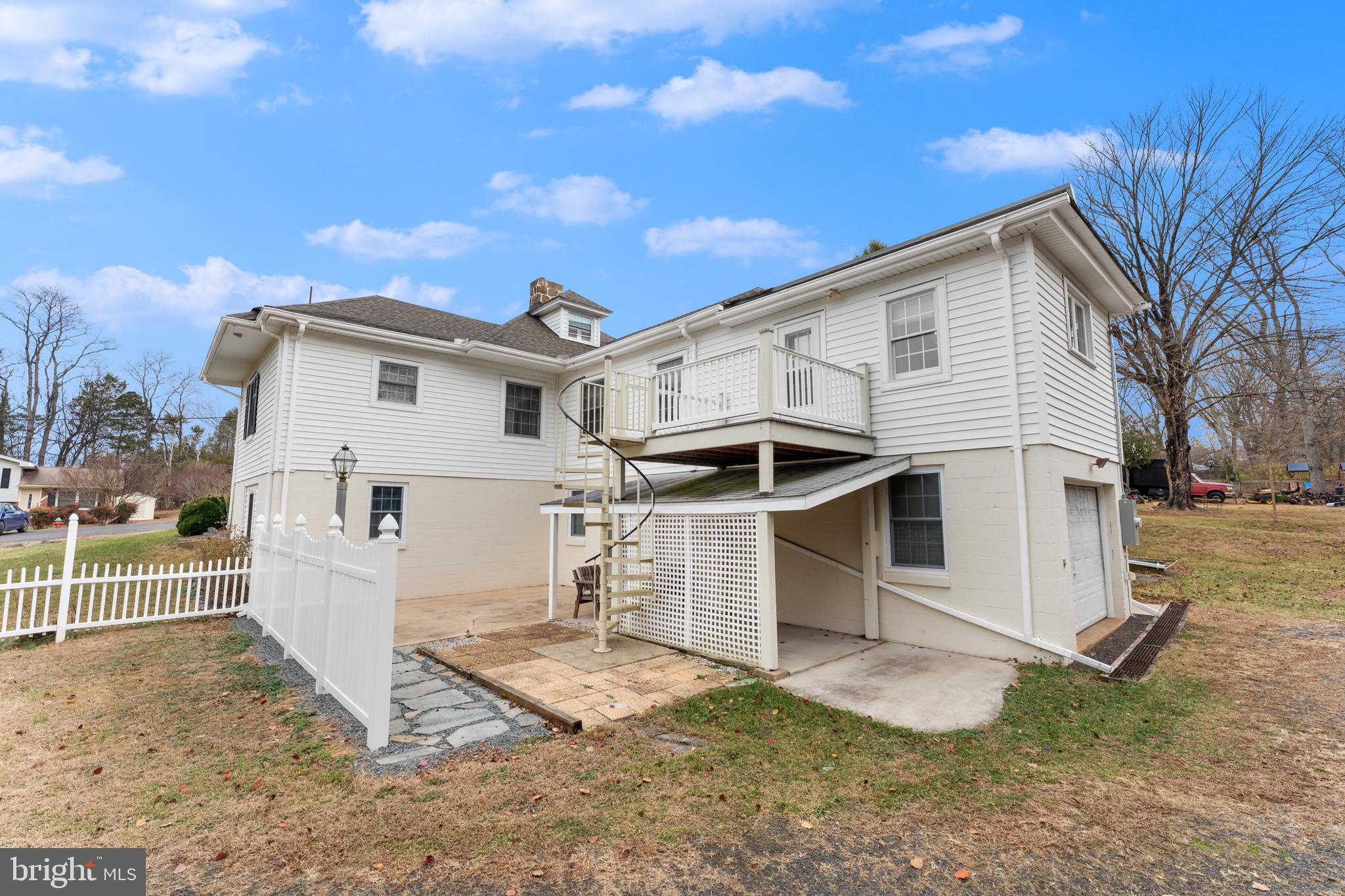 210 Elizabeth Street Culpeper, VA 22701 - Photo 41 of 48 a view of a white house with a big yard and large tree