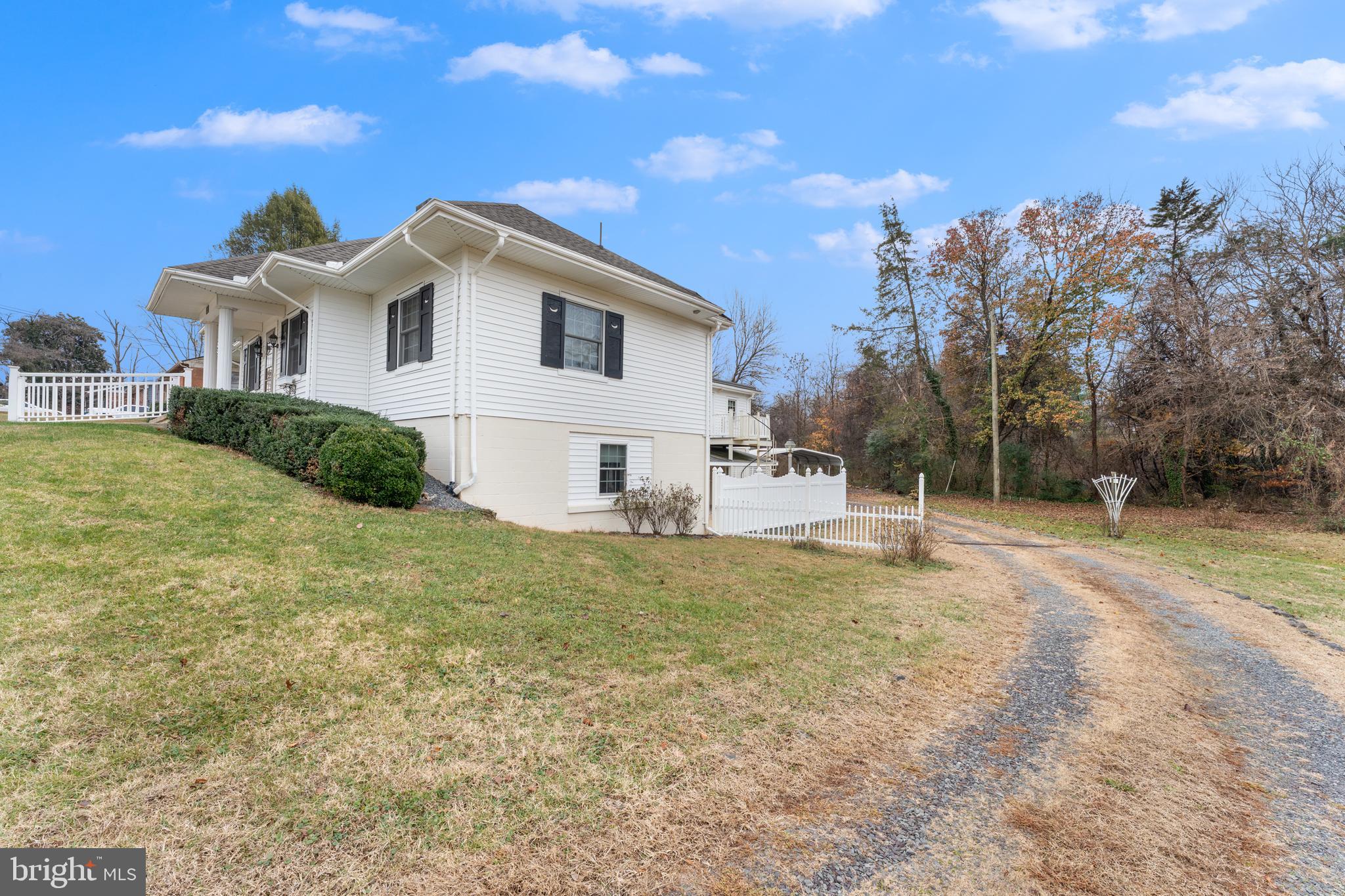 210 Elizabeth Street Culpeper, VA 22701 - Photo 46 of 48 a view of a white house with a yard