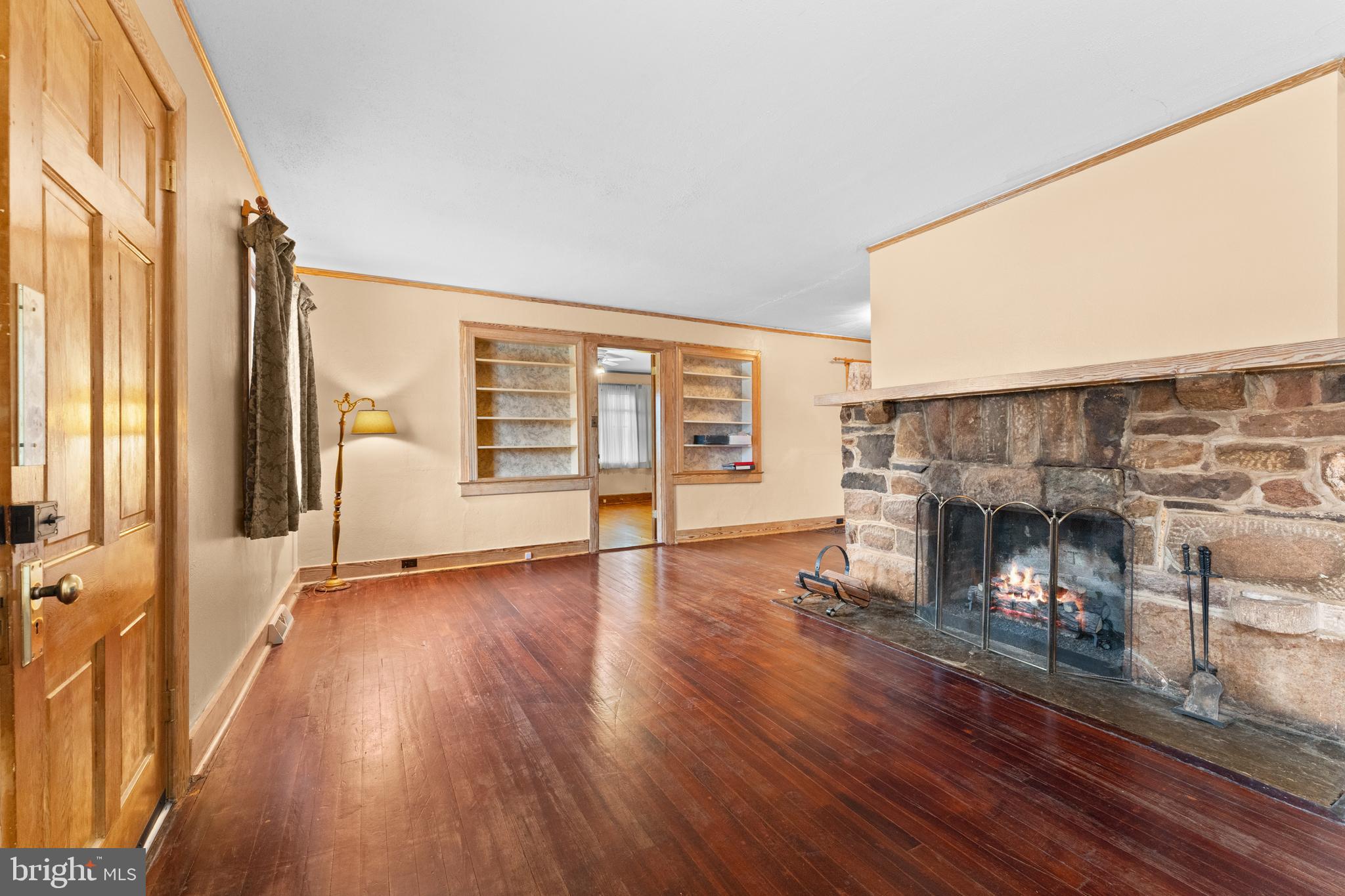210 Elizabeth Street Culpeper, VA 22701 - Photo 6 of 48 a view of a livingroom with wooden floor and a fireplace