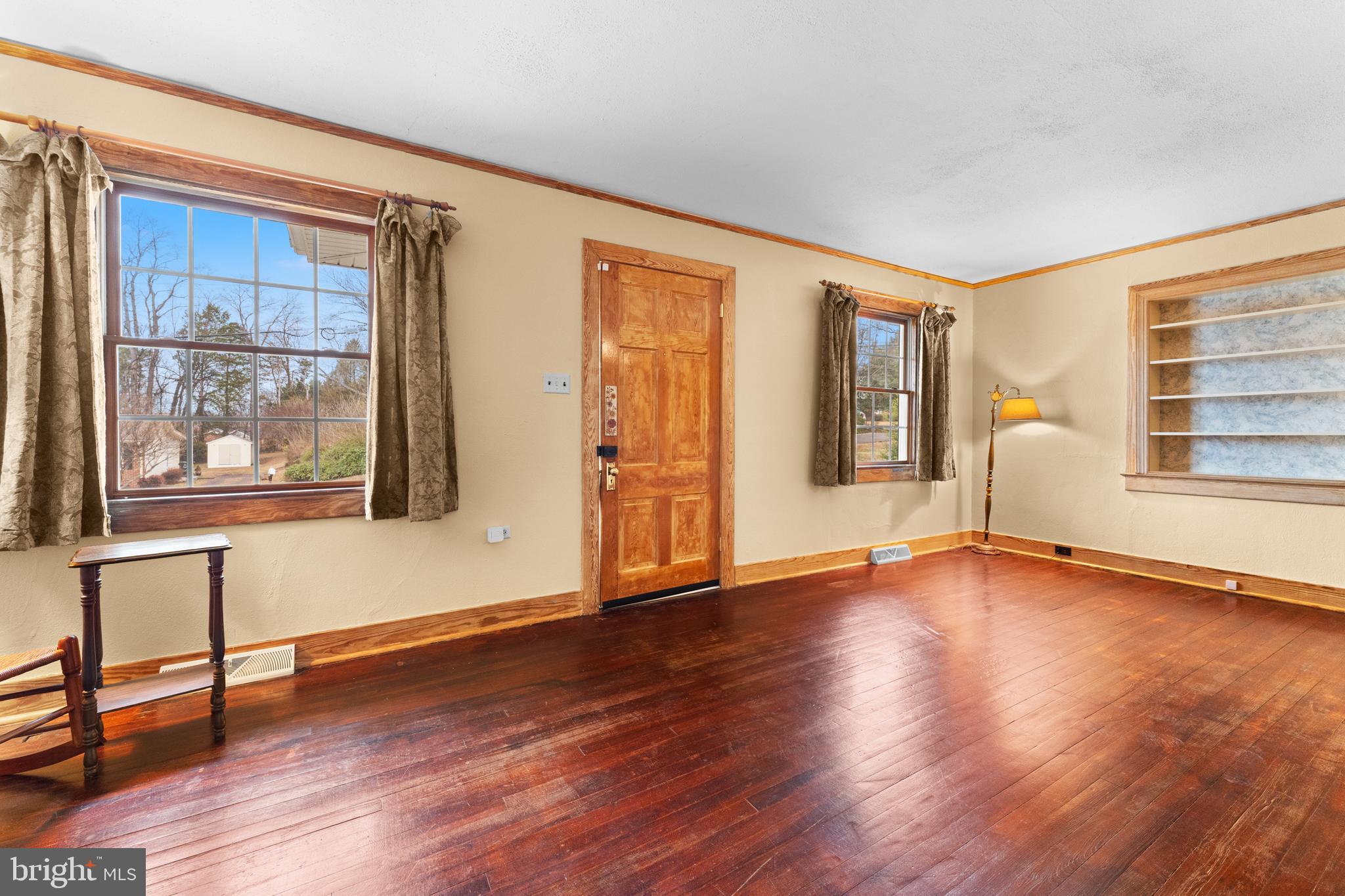 210 Elizabeth Street Culpeper, VA 22701 - Photo 7 of 48 a view of an empty room with window and wooden floor