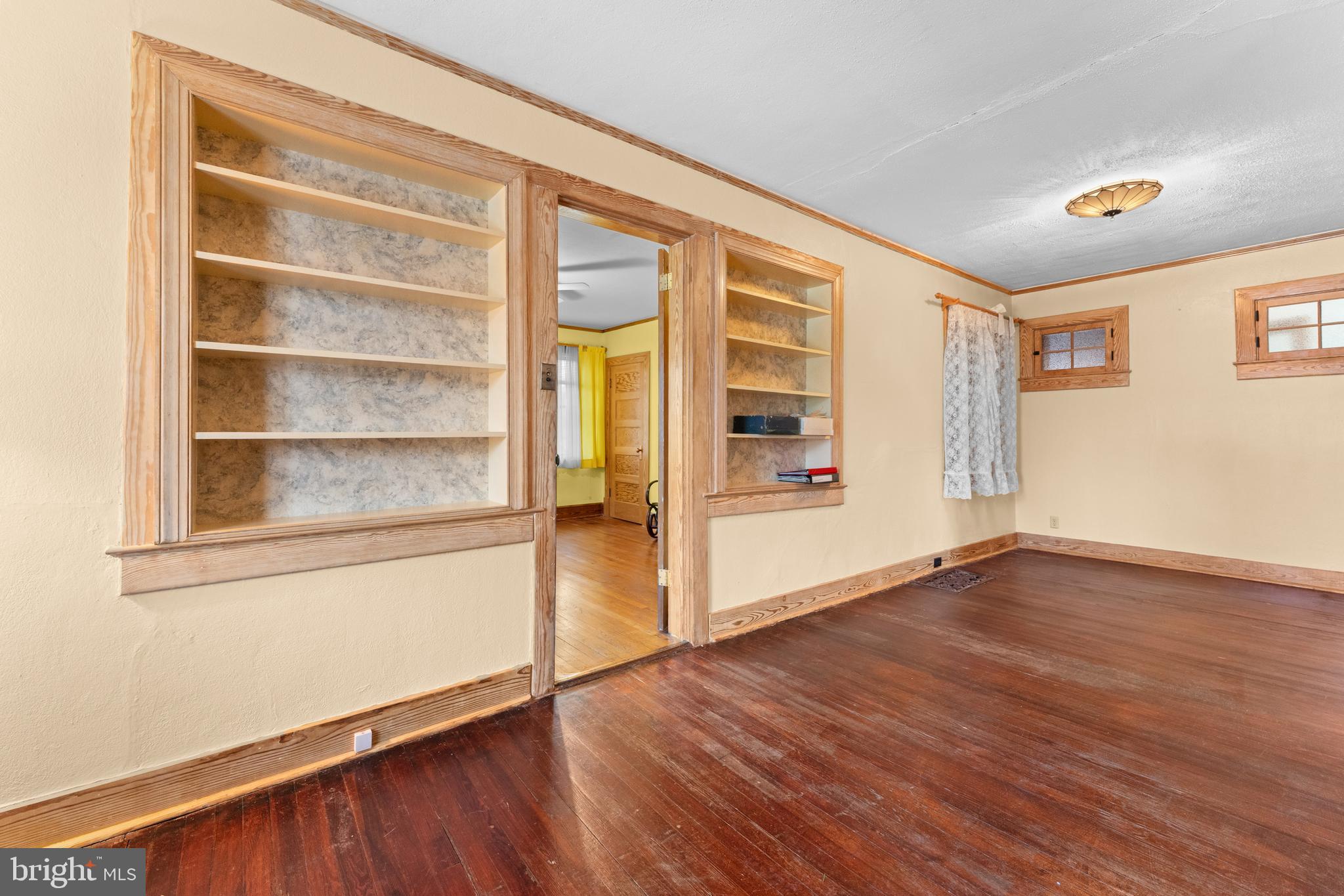 210 Elizabeth Street Culpeper, VA 22701 - Photo 9 of 48 an empty room with wooden floor and windows
