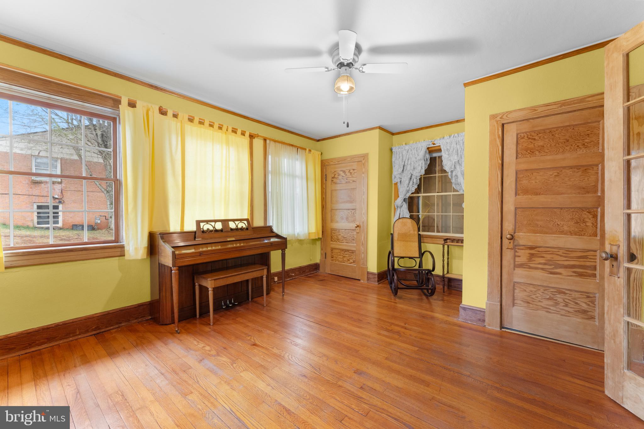 210 Elizabeth Street Culpeper, VA 22701 - Photo 10 of 48 a view of room with window wooden floor and a ceiling fan