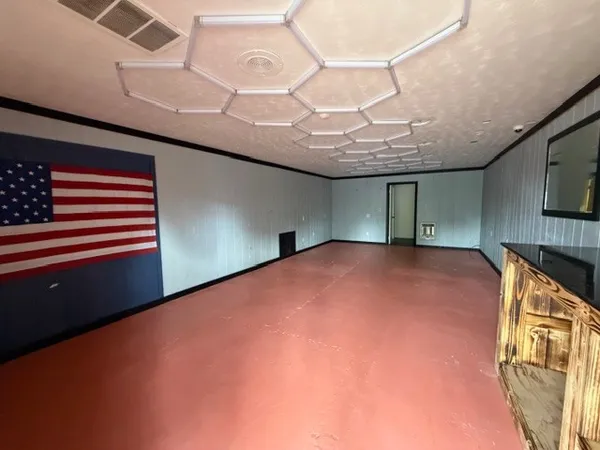 a view of empty room with windows