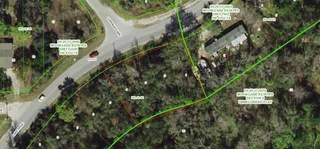 a view of a house with a tree