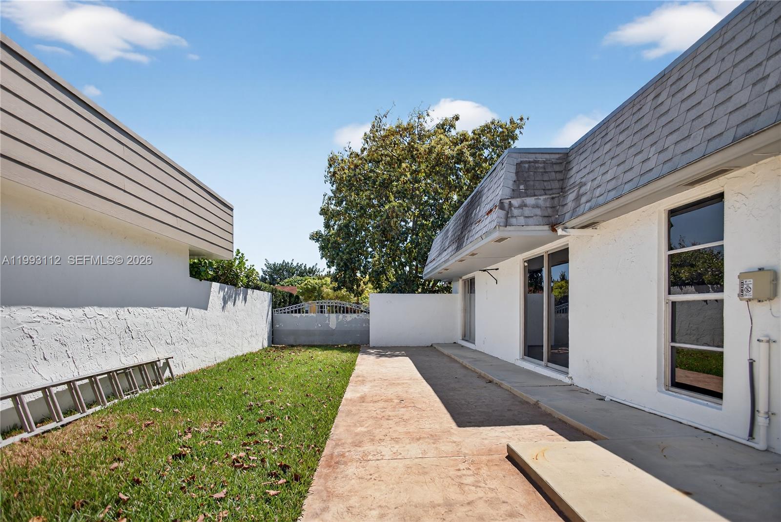 13471 Southwest 99th Terrace Miami, FL 33186 - Photo 8 of 44 a view of house and outdoor space