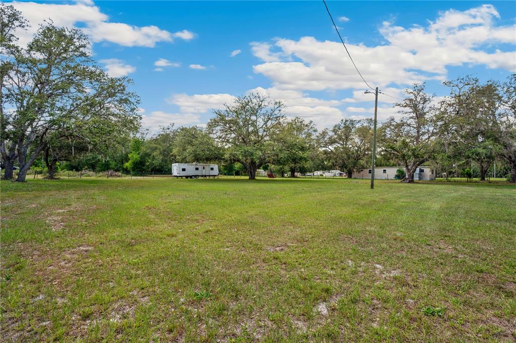 4131 Burwell Road Webster, FL 33597 - Photo 40 of 61 a view of a green field with clear sky