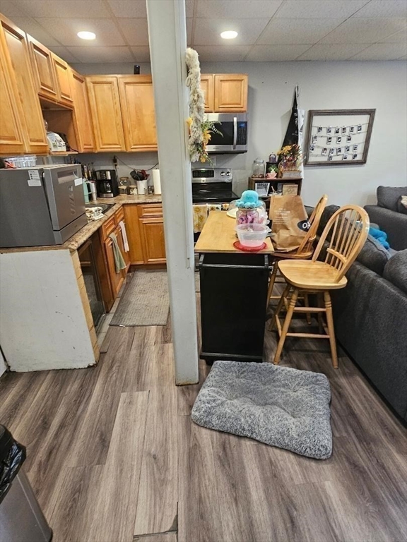 140 O'grady Fall River Fall River, MA 02720 - Photo 6 of 21 a living room with stainless steel appliances furniture wooden floor and a view of kitchen