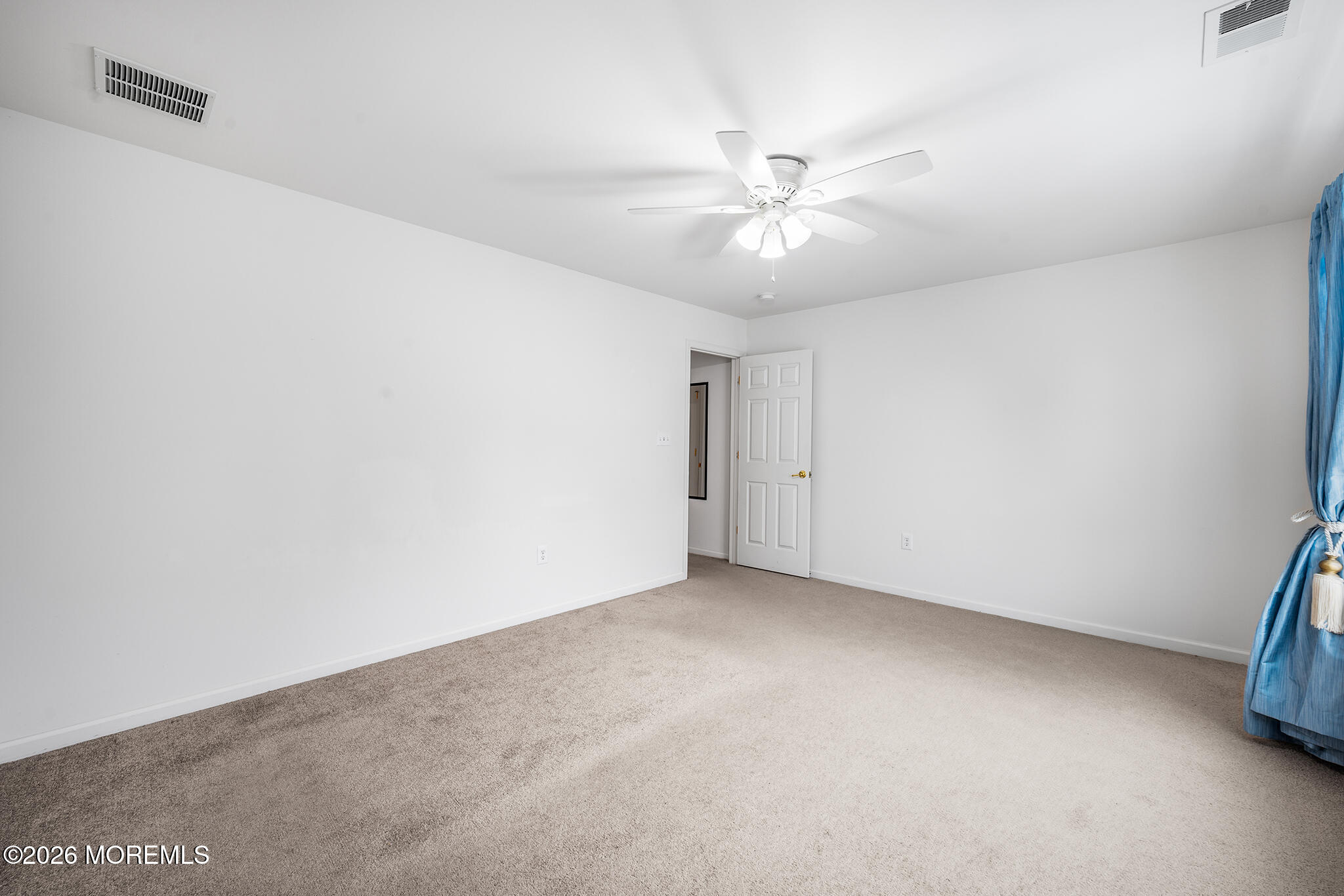 7 Brattleboro Road Jackson, NJ 08527 - Photo 35 of 62 an empty room with a ceiling fan and wooden floor