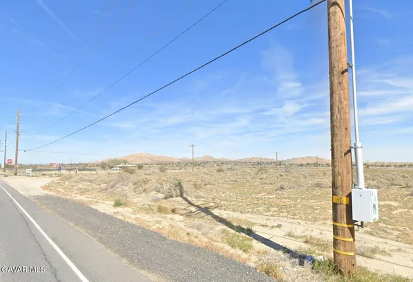 a view of a road from a big yard