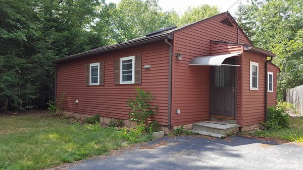 39 Ridge Way Sturbridge, MA 01566 - Photo 1 of 23 a front view of a house with garden