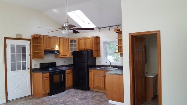 39 Ridge Way Sturbridge, MA 01566 - Photo 8 of 23 a kitchen with stainless steel appliances granite countertop a refrigerator a stove and a sink