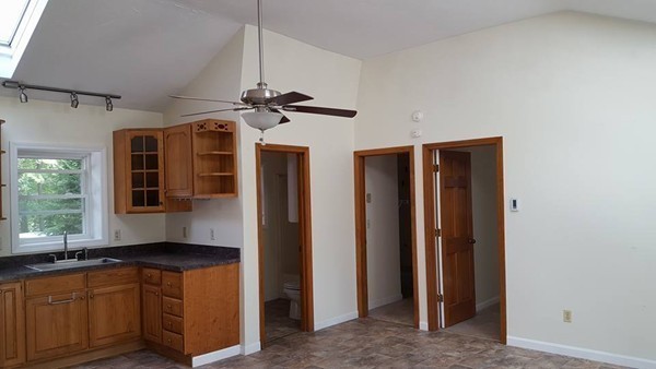 39 Ridge Way Sturbridge, MA 01566 - Photo 9 of 23 a kitchen with stainless steel appliances granite countertop a refrigerator and a sink