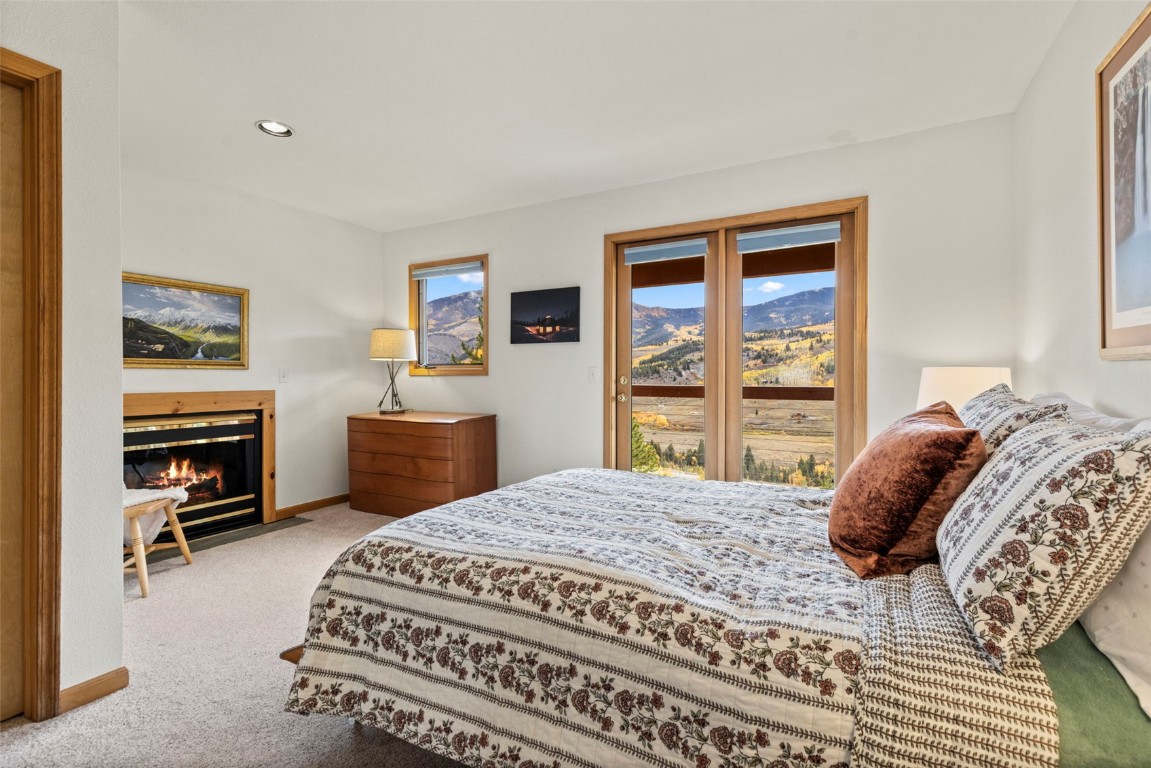 1007 Blue Ridge Road Silverthorne, CO 80498 - Photo 12 of 50 a bedroom with a bed next to a window
