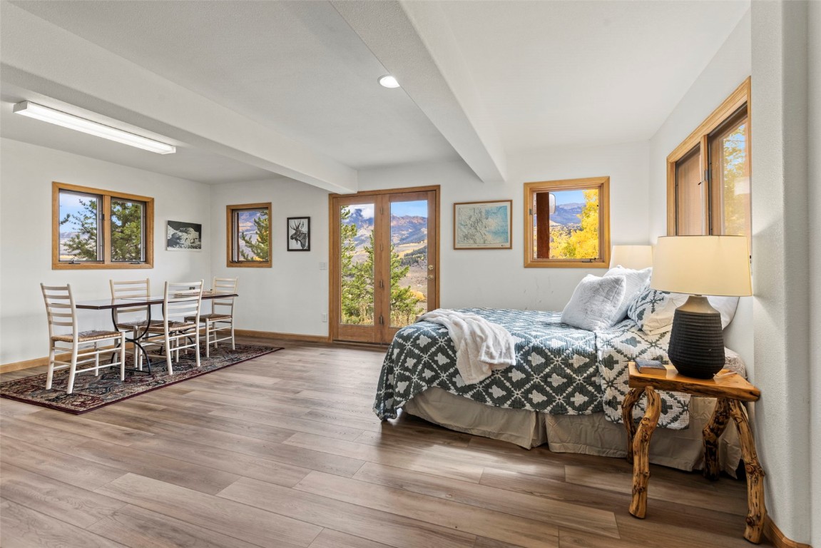 1007 Blue Ridge Road Silverthorne, CO 80498 - Photo 19 of 50 a bedroom with furniture and a window