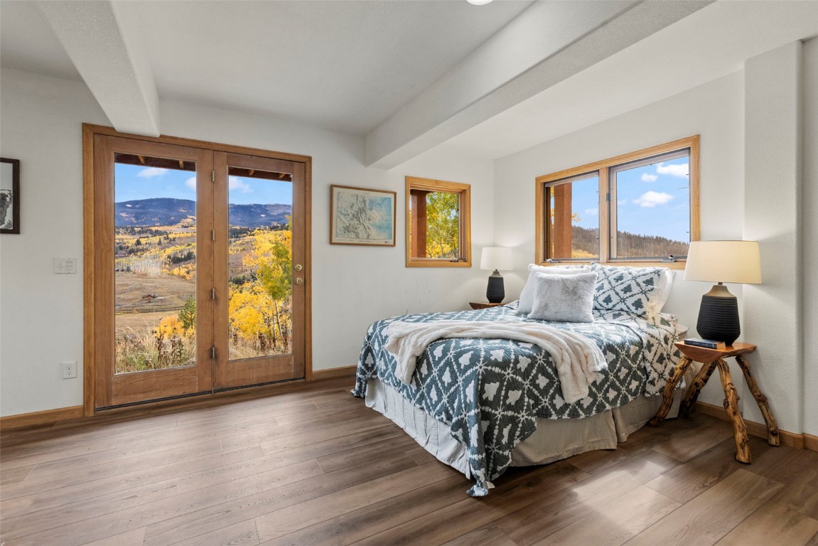 1007 Blue Ridge Road Silverthorne, CO 80498 - Photo 20 of 50 a bed sitting in a spacious bedroom next to a window