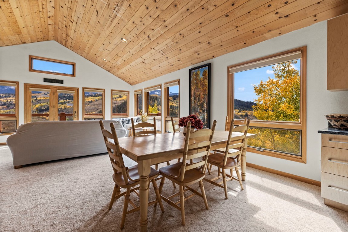1007 Blue Ridge Road Silverthorne, CO 80498 - Photo 33 of 50 a dining room with furniture a rug and a large window