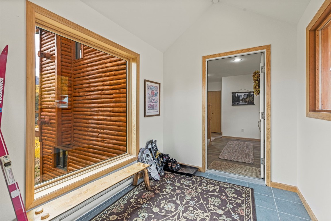 1007 Blue Ridge Road Silverthorne, CO 80498 - Photo 44 of 50 a view of a hallway and a livingroom with wooden floor