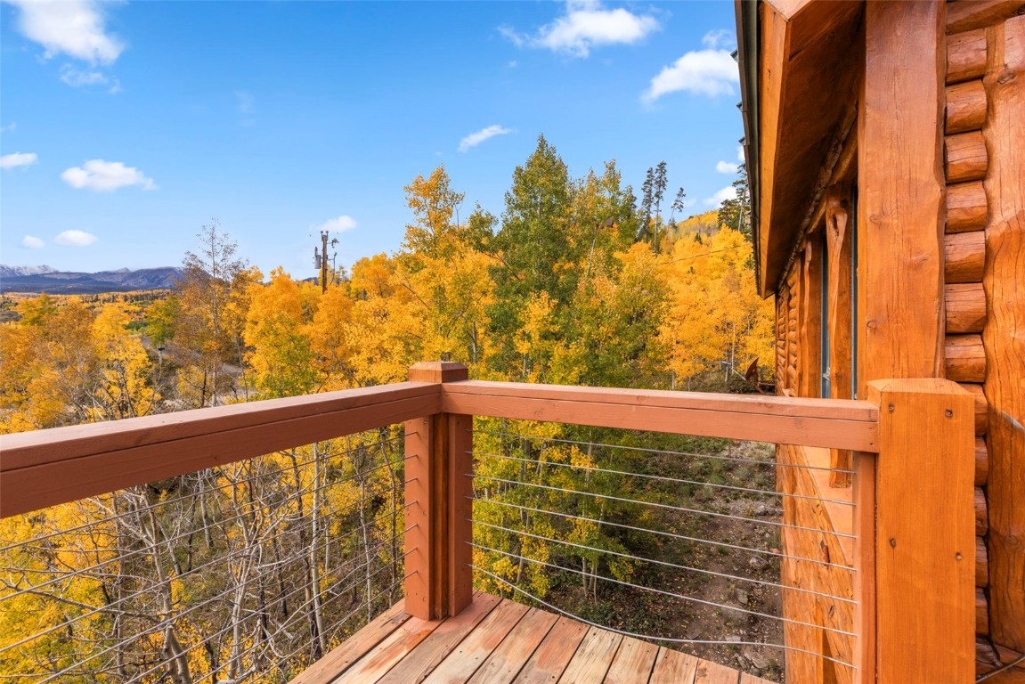 1007 Blue Ridge Road Silverthorne, CO 80498 - Photo 50 of 50 a view of a balcony with wooden floor & fence