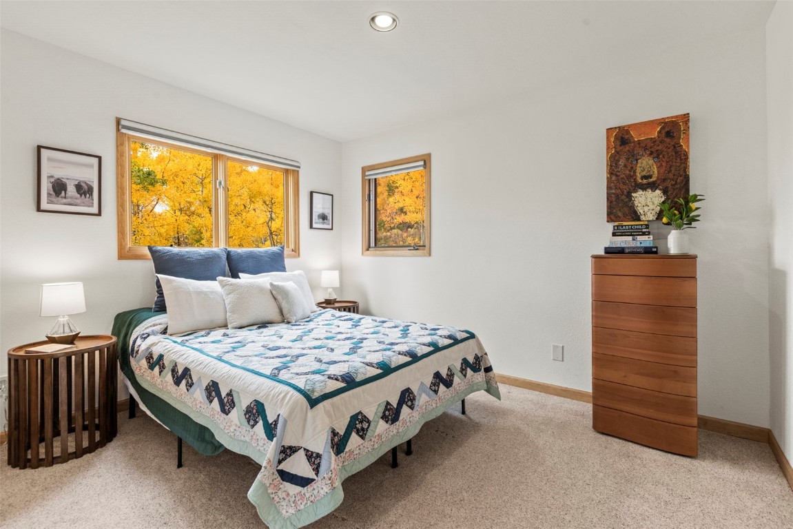 1007 Blue Ridge Road Silverthorne, CO 80498 - Photo 6 of 50 a bedroom with a bed and a window