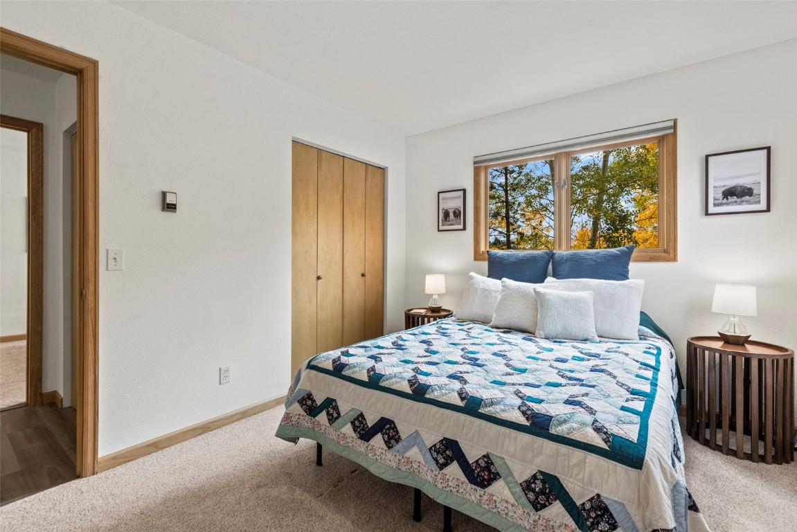 1007 Blue Ridge Road Silverthorne, CO 80498 - Photo 7 of 50 a bedroom with a bed and a window