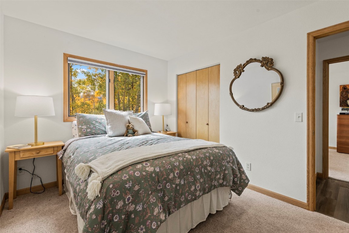 1007 Blue Ridge Road Silverthorne, CO 80498 - Photo 9 of 50 a bedroom with a bed and a window