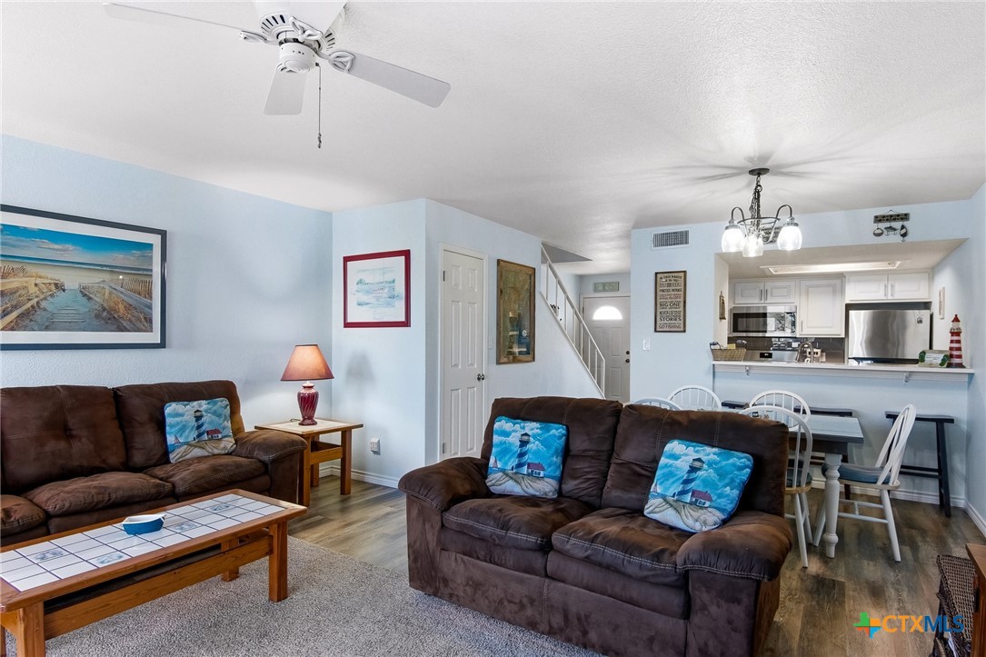 2292 North Fulton Beach Road, Unit 505 Rockport, TX 78382 - Photo 9 of 46 a living room with furniture and a kitchen