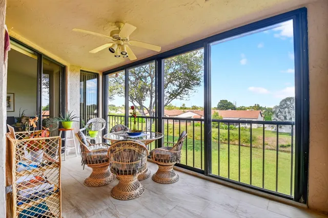 an aerial view of multi story residential apartment building with yard