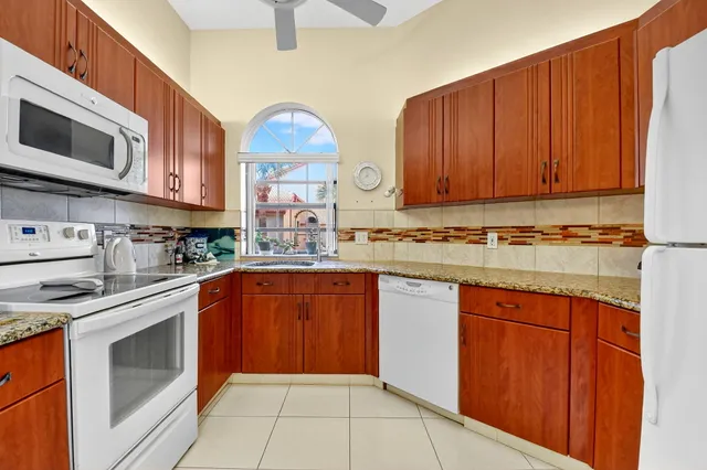 a room with pool table and windows