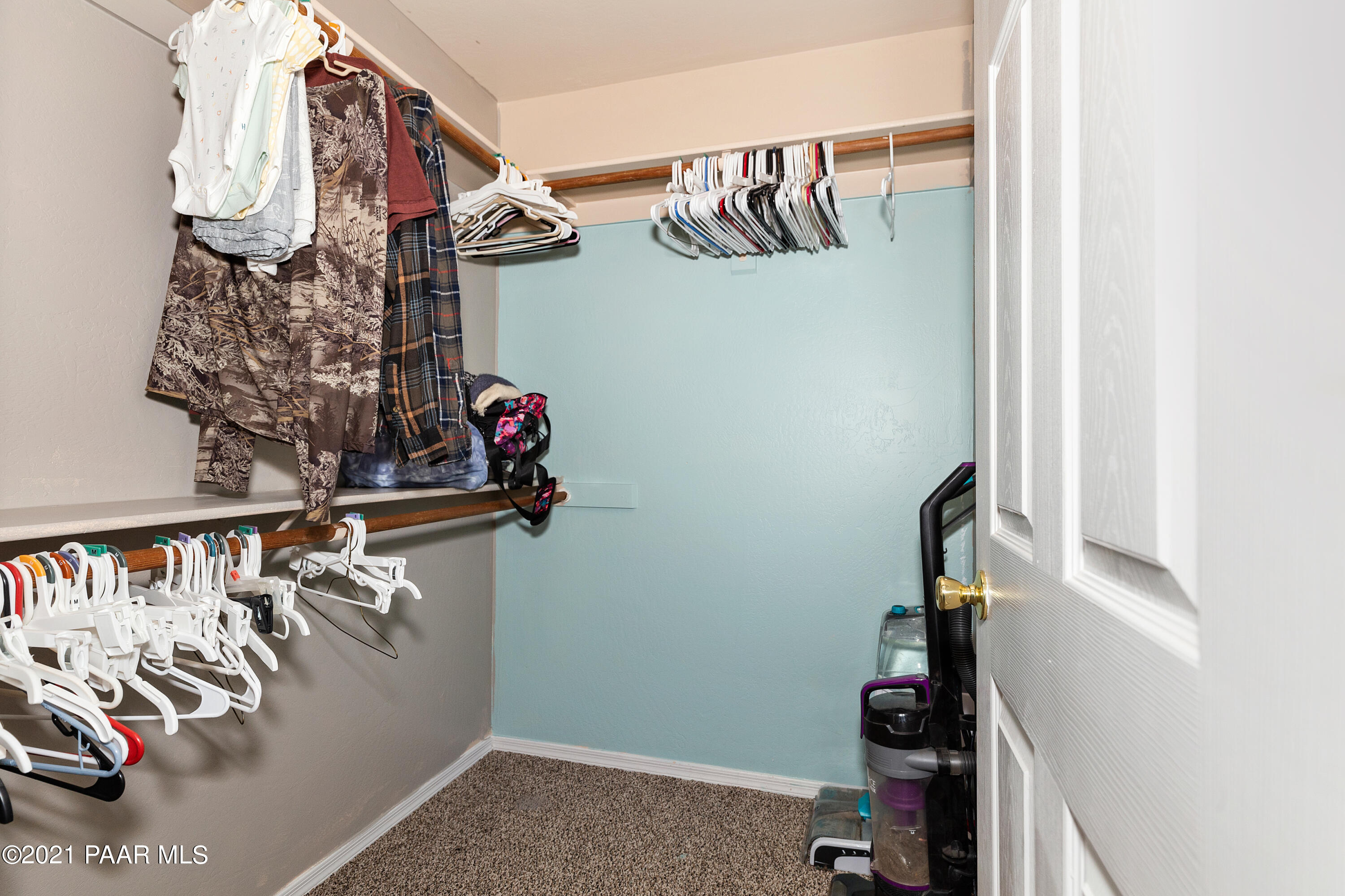 741 Gail Gardner Way, Unit I Prescott, AZ 86305 - Photo 11 of 16 a view of walk in closet with clothes and shoes