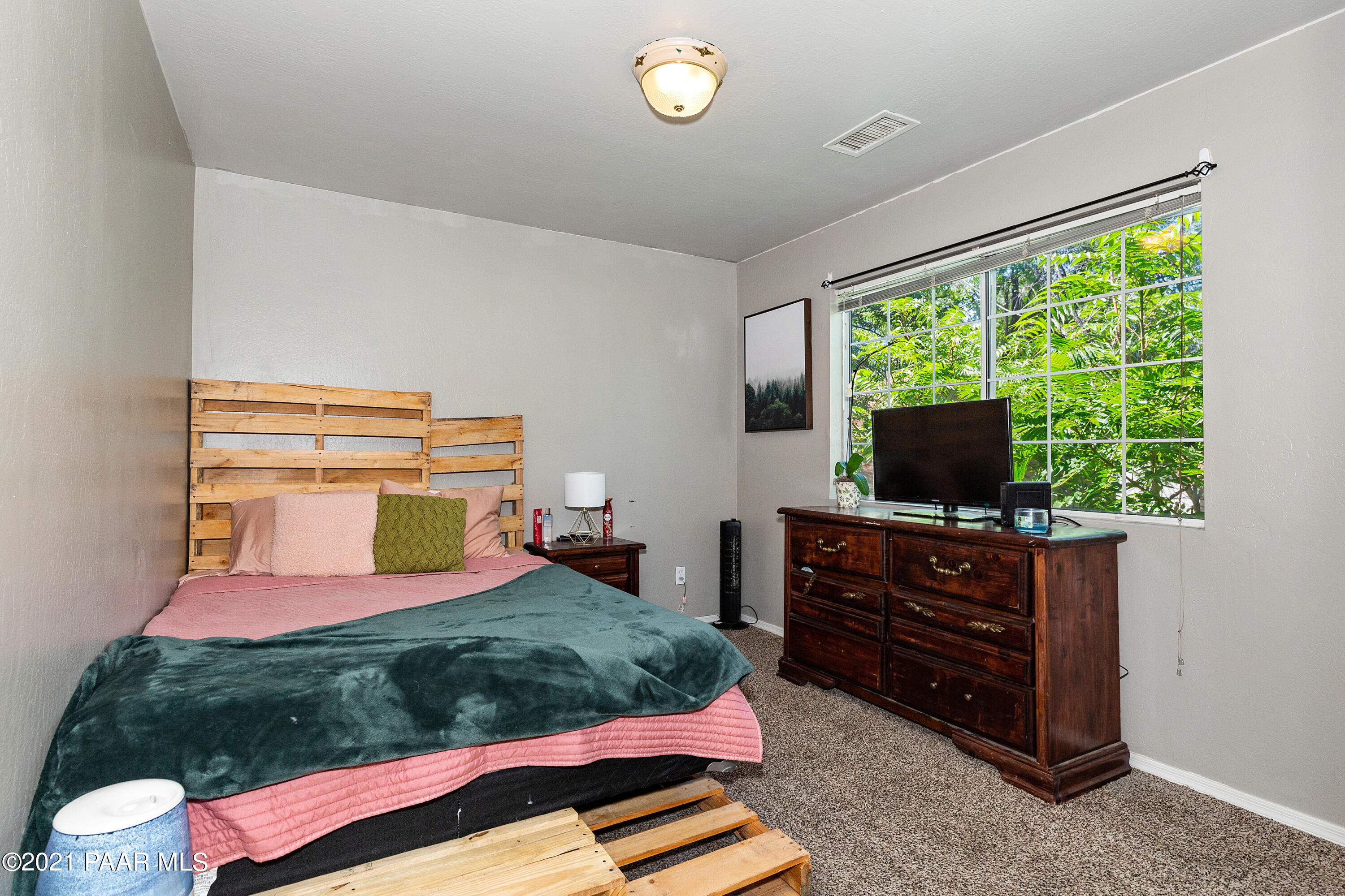 741 Gail Gardner Way, Unit I Prescott, AZ 86305 - Photo 12 of 16 a bedroom with a bed and flat screen tv